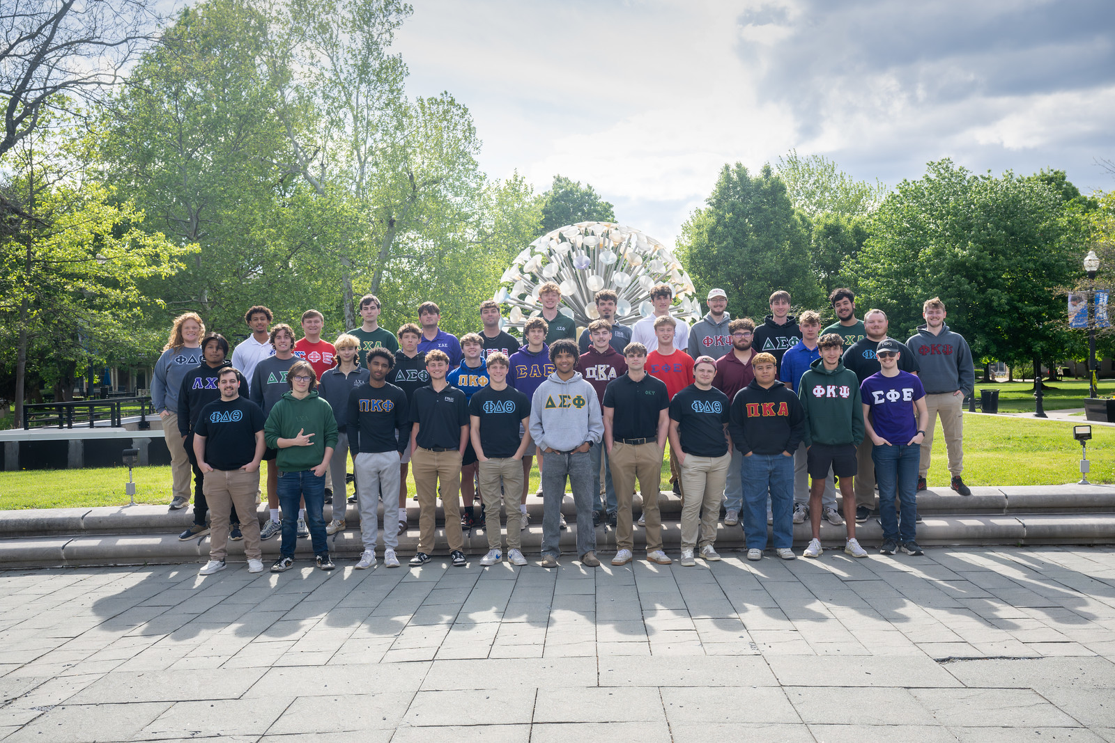 Group photo of the 2026 IFC community in front of Sticky Ball.