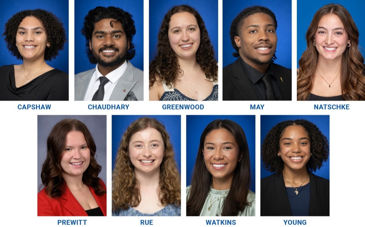 Nine smiling students, dressed in formal and semi-formal attire, posed against blue and gray studio backgrounds with names below each portrait.