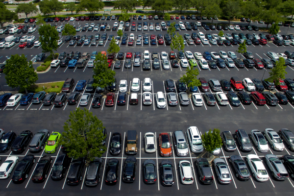 Aerial view of a parking lot with cars